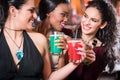 Girls enjoying nightlife in a club, drinking cocktails Royalty Free Stock Photo