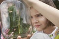 Girls Examining Stick Insects In Jar