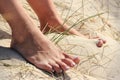 Girls feet while summer holifday at the beach Royalty Free Stock Photo
