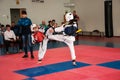 Girls fight in taekwondo