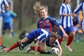 Girls fighting for ball during soccer game