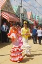 Girls in flamenco dresses at the Seville Fair. Royalty Free Stock Photo