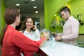 Girls flirting with barman Royalty Free Stock Photo