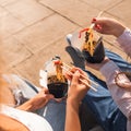 Girls friends chat and share fastfood wok noodles in a street food openair restaurant Royalty Free Stock Photo