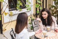 Girls friends chatting over cup of coffee on cafe Royalty Free Stock Photo