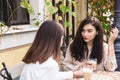 Girls friends chatting over cup of coffee on cafe Royalty Free Stock Photo