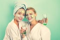 Girls friends sisters making clay facial mask. Anti age mask. Stay beautiful. Skin care for all ages. Women having fun Royalty Free Stock Photo