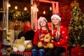 Girls friends sisters Santa claus costumes. Playful kids. December holidays. Holidays and vacation. Happy holidays