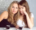 Girls girlfriends fissile secrets over coffee Royalty Free Stock Photo