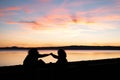 Girls give five at sunset Royalty Free Stock Photo