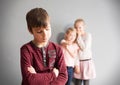 Girls gossiping about classmate Royalty Free Stock Photo