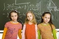 Girls at greenboard Royalty Free Stock Photo