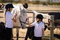 Girls grooming the horse in the ranch Royalty Free Stock Photo