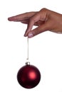 Girls hand holding bauble