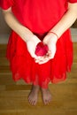 Girls hands holding a rose flower, woman first period health and gynecology . Menarche. First period party Royalty Free Stock Photo