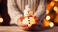 Girls hands holding snowman, close up