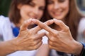 Girls hands representing the sign infinity Royalty Free Stock Photo