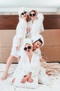 Girls hangout leisure joy women posing bathrobes Royalty Free Stock Photo