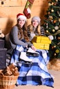 Girls with happy faces near decorated Christmas tree Royalty Free Stock Photo