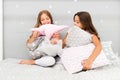 Girls happy friends with cute pillows. Pillow fight pajama party. Sleepover time for pillow fight. Doing whatever they