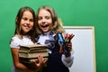 Girls with happy smiling faces and stationery Royalty Free Stock Photo