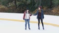 Girls have a lot of fun doing ice skating in New Yorks Central Park
