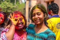Girls having colours on their faces