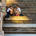 Girls having lunch on the stairs in old town in Bucharest, Romania, 2019 Royalty Free Stock Photo