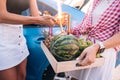 Girls hold a fruit tray and prepare a festive firework. Royalty Free Stock Photo