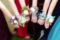 Girls Holding Arms Out with Corsage Flowers for Prom Royalty Free Stock Photo