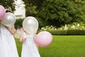 Girls Holding Balloons In Garden Royalty Free Stock Photo