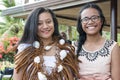 Girls from Island in Tonga, South Pacific. Girls in typical raffia garb Royalty Free Stock Photo