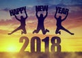 Girls jumps up while celebrating New Year 2018. Royalty Free Stock Photo