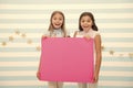 Girls kids hold advertisement poster copy space. Children hold advertising banner. Happy children with blank paper for Royalty Free Stock Photo