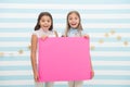 Girls kids hold advertisement poster copy space. Children hold advertising banner. Happy children with blank paper for Royalty Free Stock Photo