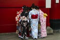 Girls in kimano dresses stand near the wall  in Senso-ji Temple Asakusa area, Tokyo, Japan Royalty Free Stock Photo