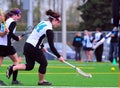 Girls Lacrosse player after the ball Royalty Free Stock Photo