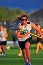 Girls Lacrosse race after the ball Royalty Free Stock Photo