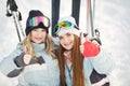 Girls posing against backdrop of mountains in ski gear. Royalty Free Stock Photo