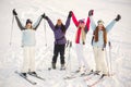 Girls posing against backdrop of mountains in ski gear. Royalty Free Stock Photo
