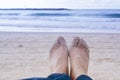 Girls legs close-up on the coast of Tel Aviv. Evening, beach and Royalty Free Stock Photo