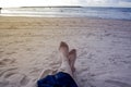 Girls legs close-up on the coast of Tel Aviv. Evening, beach and Royalty Free Stock Photo