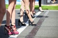 Girls legs in high heels on the starting grid