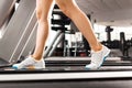 Girls legs walking at the treadmill in the gym Royalty Free Stock Photo