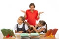 The girls in the lesson made a squabble, the teacher does not know what to do with them Royalty Free Stock Photo