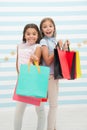 Girls like shopping. Kids happy small girls hold shopping bags. Enjoy shopping with best friend or sister. Girlish