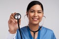 Girls with makeup are pretty, women with a stethoscope gorgeous. Portrait of a young doctor using a stethoscope against