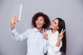 Girls making selfie photo on tablet computer Royalty Free Stock Photo