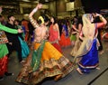 Girls, Man, women are performing garba and dandiya dance wearing traditional Indian folk dress during Navratri festival,Canada Royalty Free Stock Photo