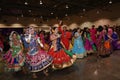 Girls, man and women are wearing traditional Indian folk dress during Navratri festival garba and dandiya dance in Canada, 2018